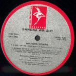 Sandra_Wright_Wounded_Woman_Label_B.jpg