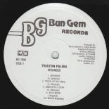 00_-_Triston_Palma_-_Wounded-Label.jpg