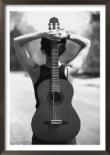 PF_1621190Young-Woman-Holding-an-Acoustic-Guitar-Behind-Her-.jpg